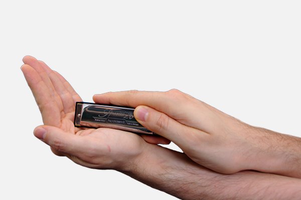 Mundharmonika auf Handfläche